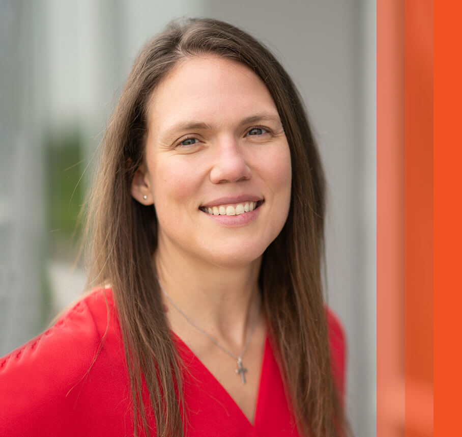 Taylor headshot with orange bars.