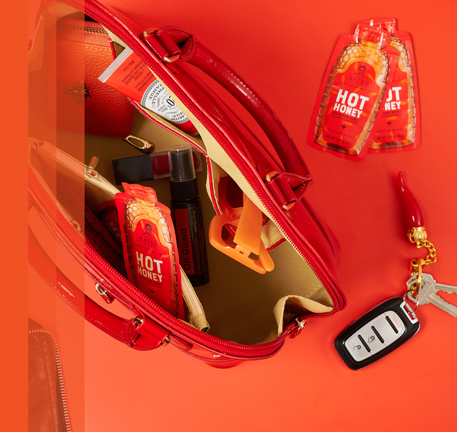 Nature Nate’s Hot Honey Minis tucked inside a red purse.