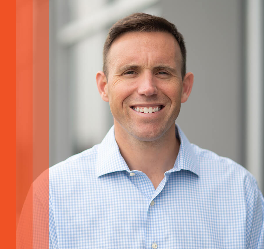 Drew headshot with orange bars.