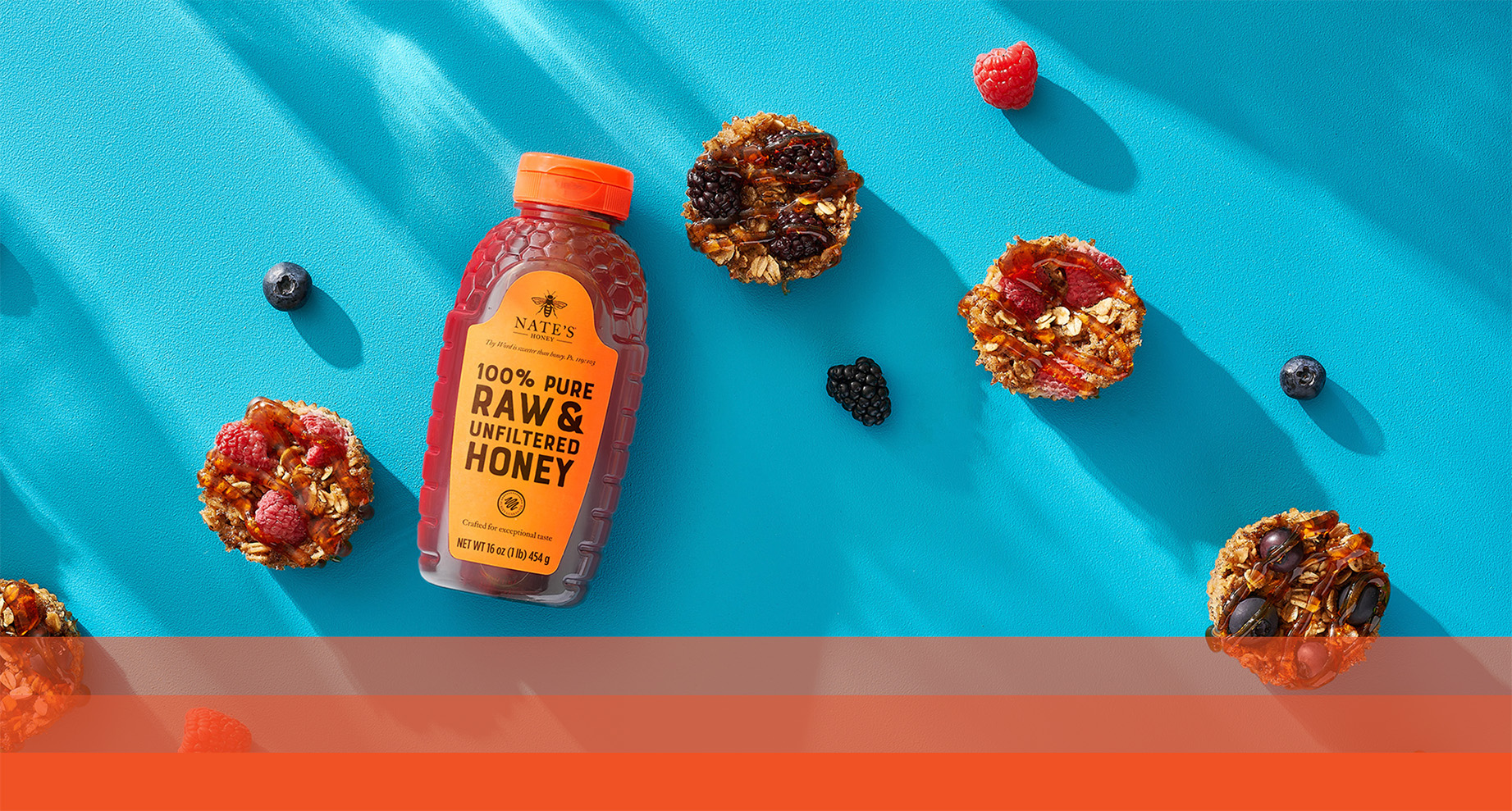 Nate's honey bottle with baked oatmeal cups made with oats, fruit and Nate’s honey.