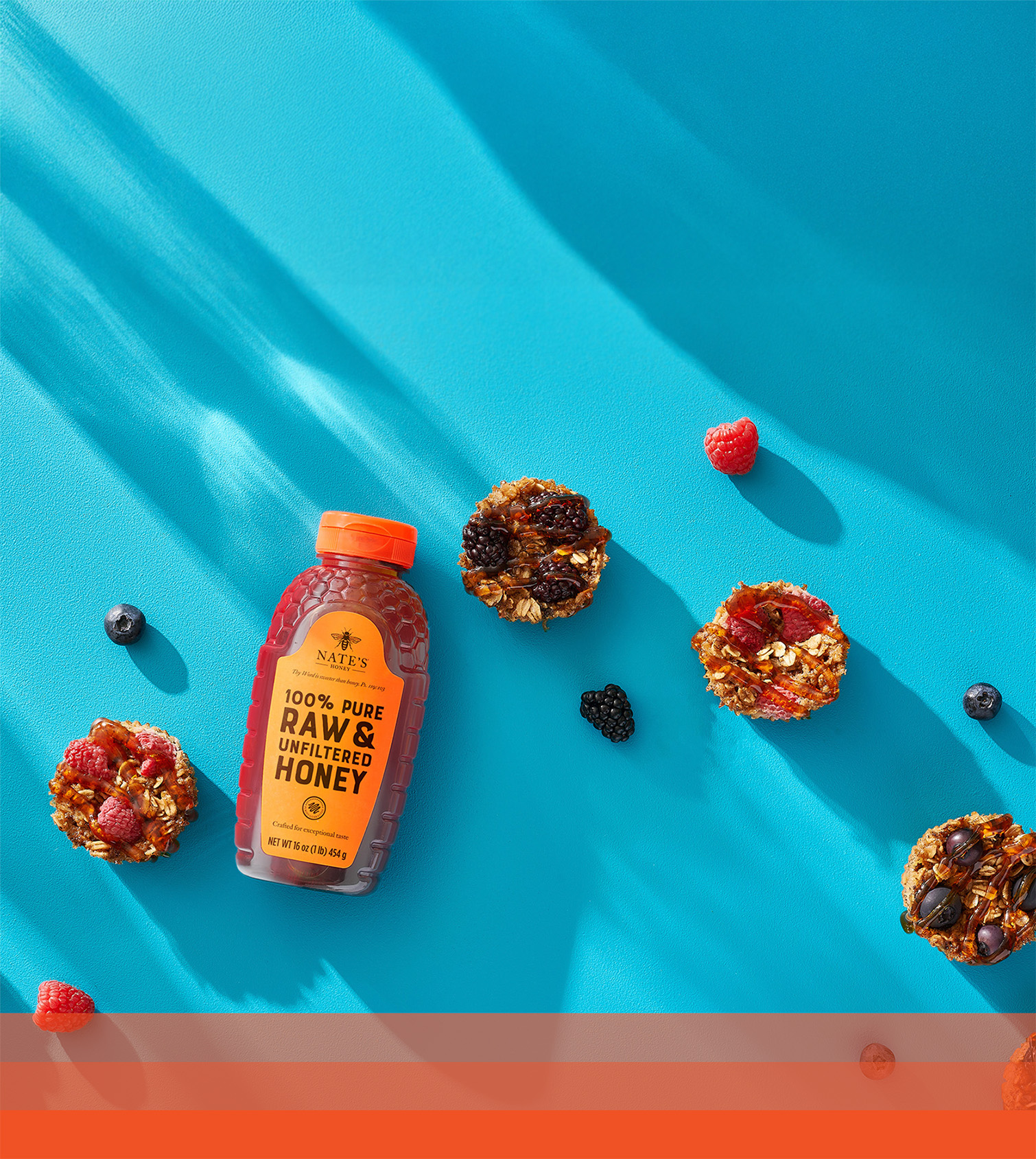 Nate's honey bottle with baked oatmeal cups made with oats, fruit and Nate’s honey.