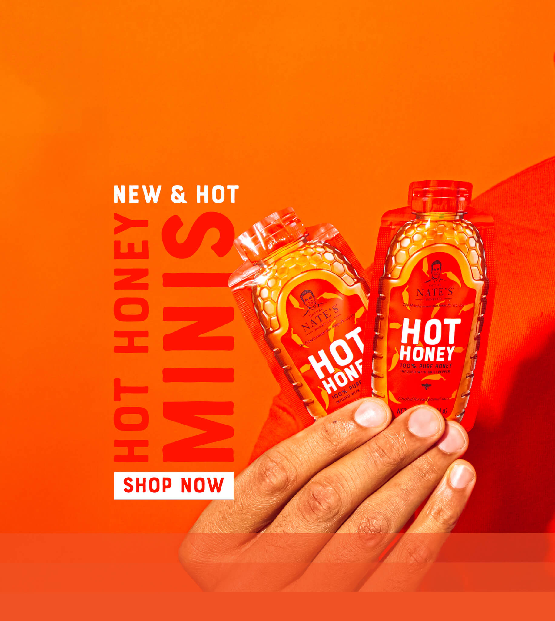 Two hot honey minis held in a hand against an orange background, with bold text reading 'Hot Honey Minis this link will open in a new window.
