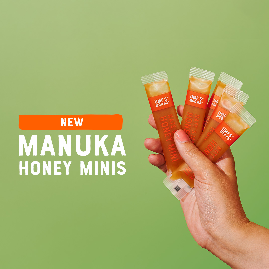 Hand holding Manuka Minis with text "New Manuka Honey Minis".