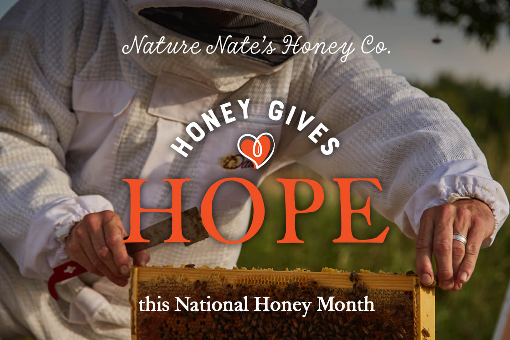 A beekeeper holding a honeycomb frame, overlaid with text "Nature Nate's Honey Co., HONEY GIVES HOPE this Holiday Season.