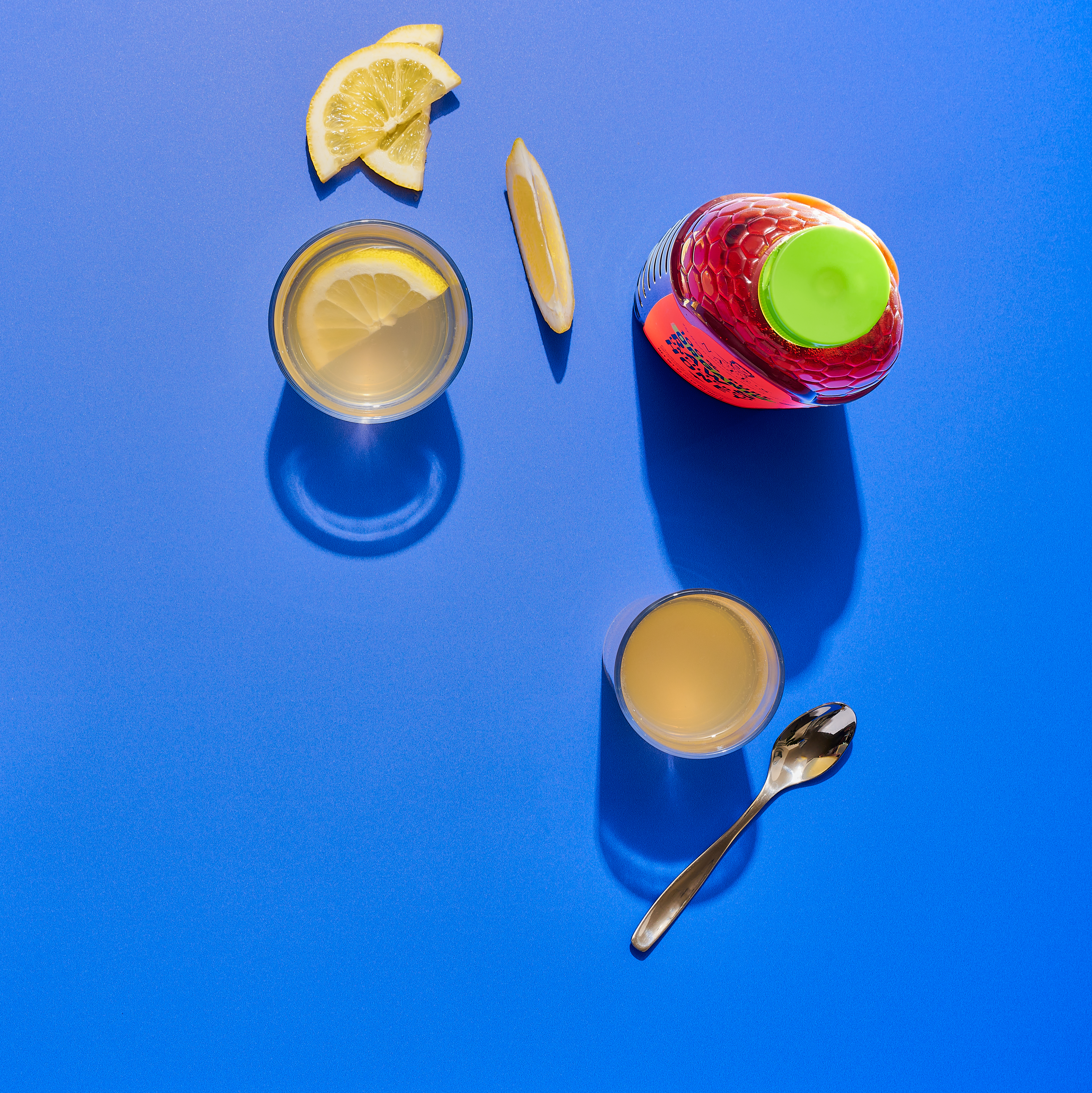 Glass of water with lemon and Nate's organic honey.