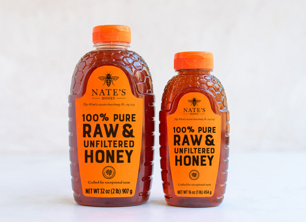 Front of 16 and 32-ounce bottle of Nature Nate's Raw & Unfiltered Honey