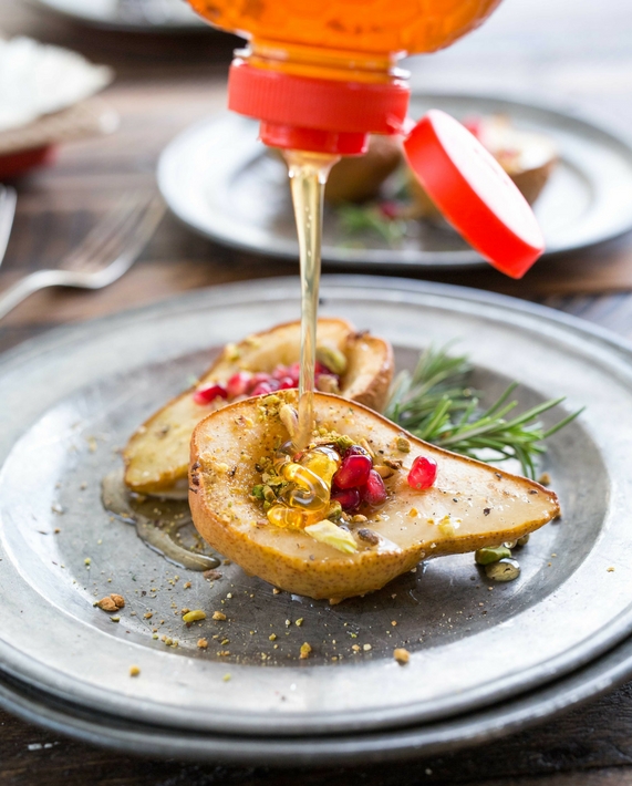 Honey poured on a pear