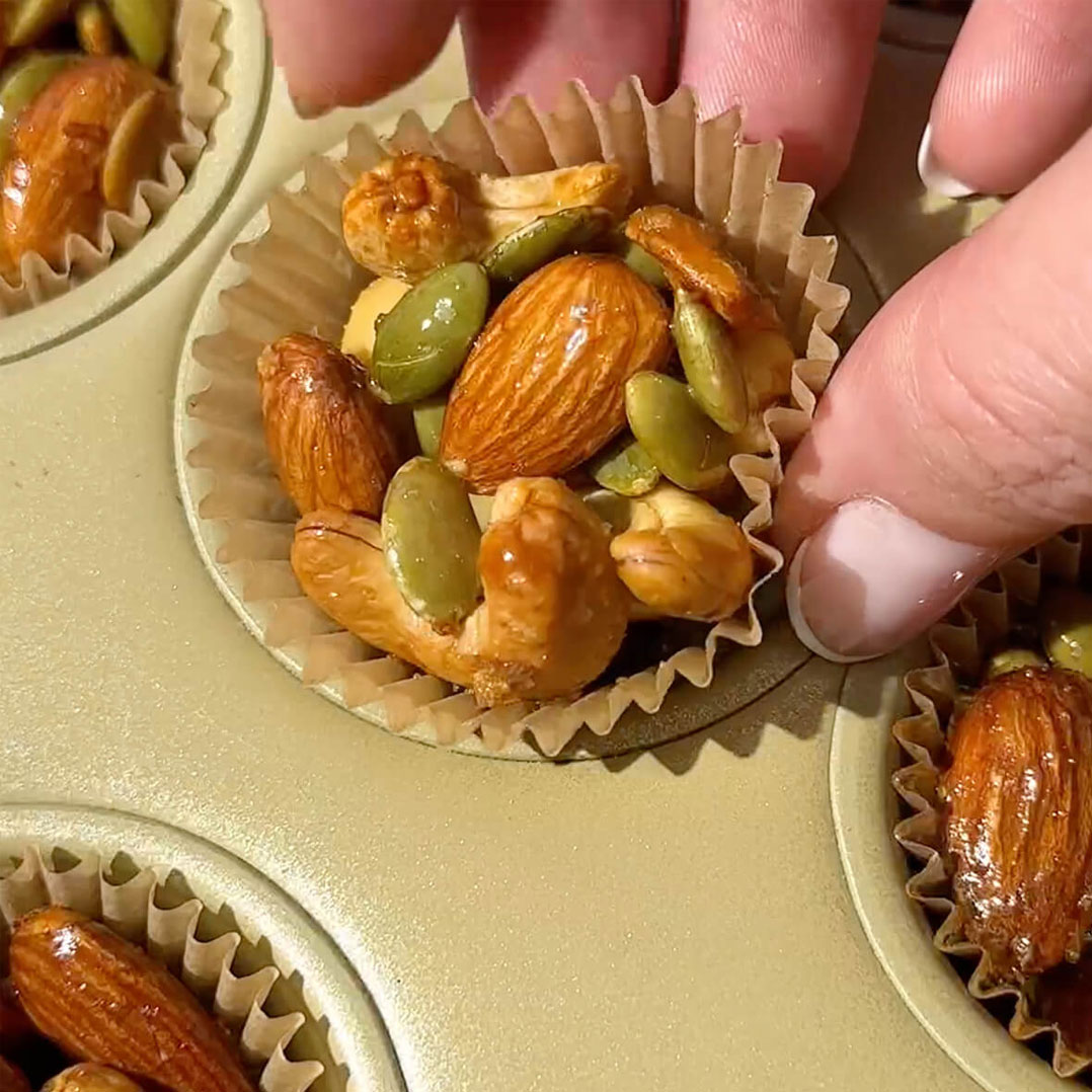 Nut and seed cluster in muffin tin.