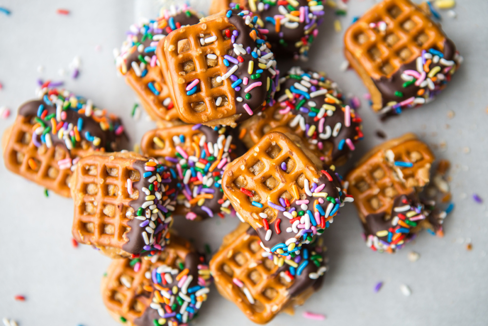Chocolate-dipped waffle pretzels 
with colorful sprinkles on top.